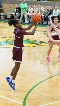 Littlefield freshman, Amoni Jefferson drains a three from the right elbow and draws and-one foul on Idalou, converting a four-point play, during the second half of the Lady Cats, 47-42 loss to Idalou in their district-opener on Tuesday. (Staff Photo by Derek Lopez)