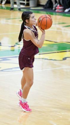 Littlefield senior, Cali Saldana, drains a three from the right elbow, during the Lady Cats’ second half rally against Idalou on Tuesday. Littlefield fell short, 47-42, in their district-opener on Tuesday. (Staff Photo by Derek Lopez)