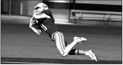 Littlefield’s Jacob Fuentes dives to make a touchdown catch in the back of the endzone, during the third quarter of the Wildcats homecoming loss to Levelland last Friday. (Staff Photo by Derek Lopez)