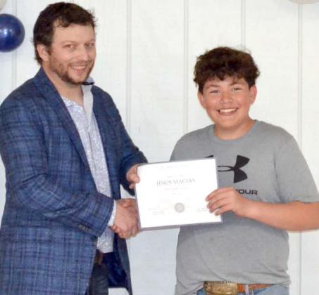 Jr Livestock showman Issac Salazar with Tyler Classen