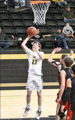 POINTS IN THE PAINT— Springlake-Earth junior, Trace Goodman, drops in a lay-up, during the second half of the Wolverine’s lAArea Play-off victory over the Tigers on Tuesday at Vega High SchooL (Staff Photo by Derek Lopez)