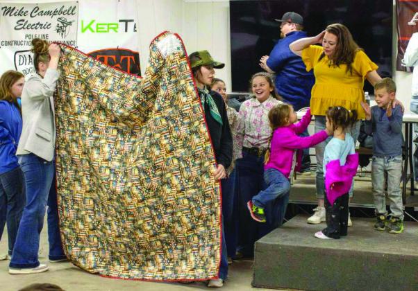 Two 4-H Veteran parents receive Quilts of Valor at Littlefield Area Stockshow