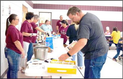 LITTLEFIELD PRIMARY STAFF served up mini pancakes at the Family Reading Night held Thursday, September 28, 2023. (Photo by Ann Reagan)