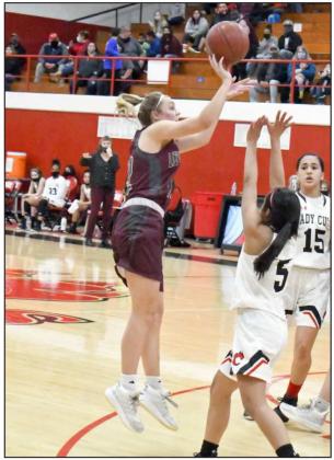 SHOOTING THE JUMPER—Littlefield sophomore, Madison McNeese (12), shoots a jumper over Lindsey Herrera (5), during the Lady Cats’ first meeting with the Lady Cubs on the road on Friday at the Pit. (Staff Photo by Derek Lopez)