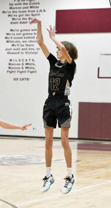 Sudan’s Slade Nichols fires up a three from the left elbow, during the first half of the Hornets opening round loss to the New Home Leopards at the Wildcat Classic last Friday. (Staff Photo by Derek Lopez)
