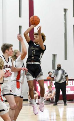 Sudan’s Jaibryn Ornelas puts up a floater in the lane over the New Home defense, during the first half of the Hornets opening round loss to the Leopards at the Wildcat Classic last Friday. (Staff Photo by Derek Lopez)