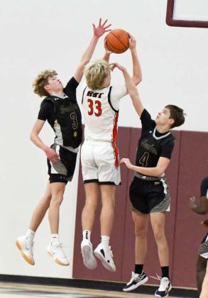 Sudan’s Aspen Reyher goes up and blocks New Home’s Caleb Cook at the rim, during the first half of the Hornets opening round loss to the Leopards at the Wildcat Classic last Friday. (Staff Photo by Derek Lopez)