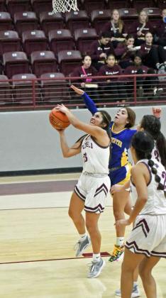 Littlefield’s Arianna Cruz (23) gets into the paint and puts up a lay-up through contact, during the first half of the Lady Cats’ Wildcat Classic victory over Hale Center last Thursday. (Staff Photo by Derek Lopez)