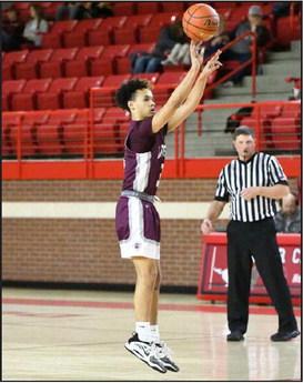 Littlefield junior guard, RyanWilliams (3), drains a three from the top of the key, during the first half of the Wildcats, 77-26, district victory over the Denver City Mustangs on the road on Friday. (Staff Photo by Derek Lopez)