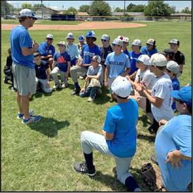 Olton Head Baseball Coach Matthew Ingle addresses the afternoon session of his youth baseball camp last week at Mustang Field. (Submitted Photo)