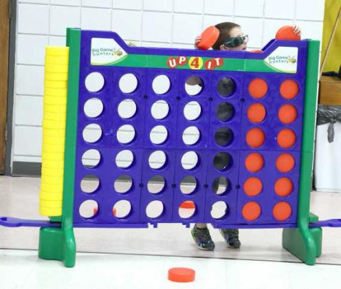 A youngster plays in the cafeteria during the STREAM event held at the Littlefield Primary School. (Photo by Ann Reagan)