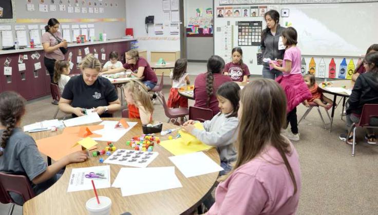 Littlefield Primary Students along with their parents work on projects during the STREAM family event held on Monday, April 14, 2024. (Photo by Ann Reagan)