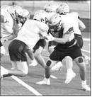 Sudan’s offensive and defensive lines get after it, during their intersquad scrimmage Saturday night at Hornet Stadium. (Staff Photo by Derek Lopez)
