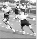 A Sudan receiver slips by a defender for a solid gain, during their intersquad scrimmage Saturday night at Hornet Stadium. (Staff Photo by Derek Lopez)