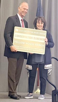 Presenting the award is Rex Isom, Executive Director of the Texas State Soil and Water Conservation Board and Tretha Caddell, Owner of Yellow House Ranch. (Submitted Photo)