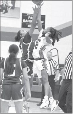 Littlefield’s Nia Cleveland (11), goes up for the opening tip- off to get the Lady Cat’s season underway last weekend at Estacado. (Staff Photo by Derek Lopez)