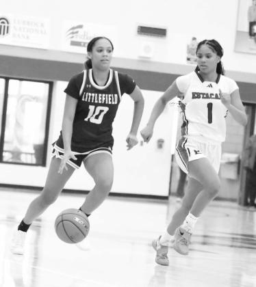 Littlefield’s Zalise Davis (10) brings the ball down court, looking to get into the paint, during the first half of the Lady Cats’ season-opening victory over the Lady Matadors last Saturday. (Staff Photo by Derek Lopez)