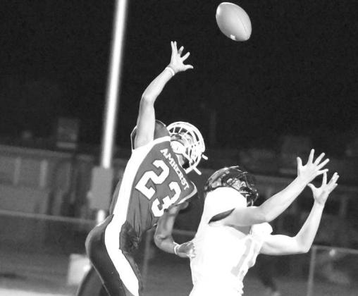 Amherst’s Aiden Rodriguez (23), breaks up a pass during the first half of the Bulldog’s victory over Lazbuddie last Thursday to close out the regular season. (Staff Photo by Derek Lopez)