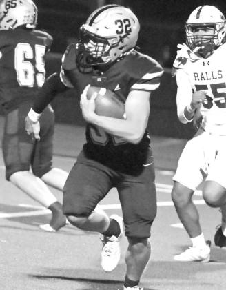 Sudan running back Halen Ruiz, looks for an opening, during the second half of the Hornet’s, 60-0, victory over Ralls to close out the regular season on Friday. (Staff Photo by Derek Lopez)