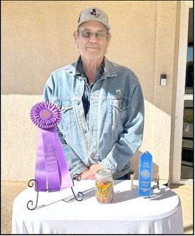 Delmer White, lifelong resident of Littlefield won First Place and Best of Show in the 2024 South Plains Fair culinary division for his pickled mix peppers. He won a total of 28 ribbons for his entries in this years fair. (Photo courtesy of Shawna Hastings)