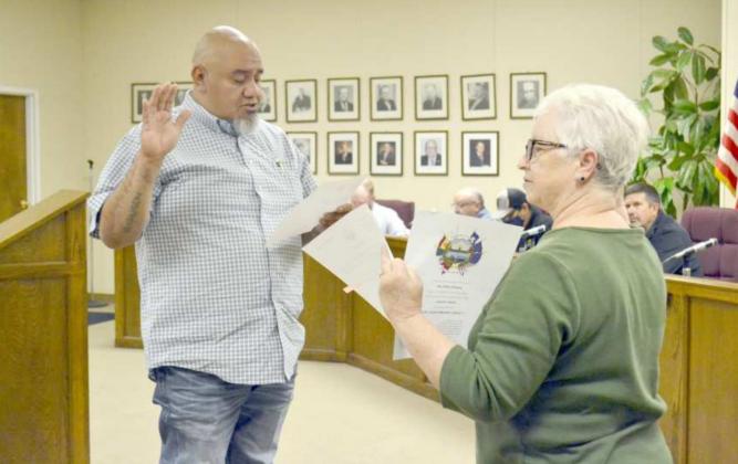NEW DISTRICT 1 CITY COUNCIL MEMBER--Eric Saenz, winner of the Nov. 3 Littlefield City Council’s District 1 election, is shown as he was being sworn into his new position Tuesday evening, Nov. 10, 2020. Administering his oath of office is City Secretary, Janine Butler. Saenz will be filling a twoyear term, which will end in May, 2022. He fills the seat that was held by Council Member Ben Warren four times in 20 years. (Staff Photo by Joella Lovvorn)