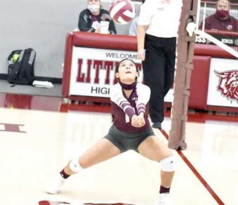PLAYING CLOSE TO THE NET – Littlefield junior, Danielle Zapata, plays a ball just in front of the net, looking to give the Lady Cats a chance to strike, during the Lady Cats’ loss to the Brownfield Lady Cubs on Saturday in their first meeting of District Play. (Staff Photo by Derek Lopez)