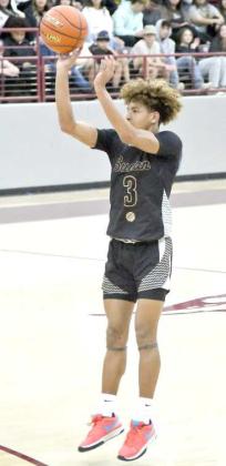 Jaibryn Ornelas pulls up for a three from the top of the key, during the Hornets’ tournament- opener at the Wildcat Classic Wednesday evening. (Staff Photo by Derek Lopez)