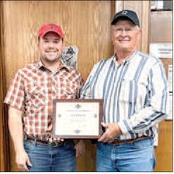Wednesday, October 7th at the SWCD office in Littlefield, Larry Hobratschk received an award for his 30 years of dedication to conservation as a board director with the Lamb County Soil &amp; Water Conservation District #130. Pictured are: Colton Vinson (left) Texas State Soil &amp; Water Conservation Board Field Representative Area I and Larry Hobratschk (right) District Director with Lamb Co. SWCD #130 and has served for 30 years. (Submitted Photo)