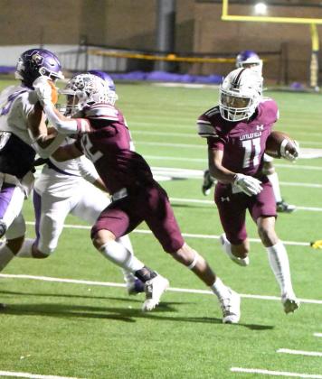Littlefield junior receiver, Zane Champion, catches a swing pass from Chip Green, as he cuts it up field, getting a downfield block from Gabriel Villanueva on his way to a 222-yard touchdown, during their 3A Area Championship victory over Crane in Lamesa on Friday. (Staff Photo by Derek Lopez)