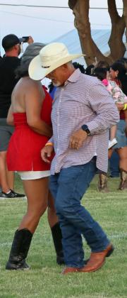 Flatland Music Festival goers dance to some live music on Saturday. (Photo by Ann Reagan)