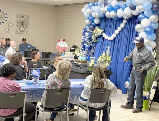 Craig Johnson, right, visiting with family and friends during his retirement party from Lamb County Electric Cooperative that was held on Friday, March 7, 2025. (Submitted Photo)