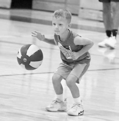 Mustang Youth Basketball campers warm up with some dribbling routines, during the first day of camp on Monday, May 25th. (Staff Photo by Derek Lopez)