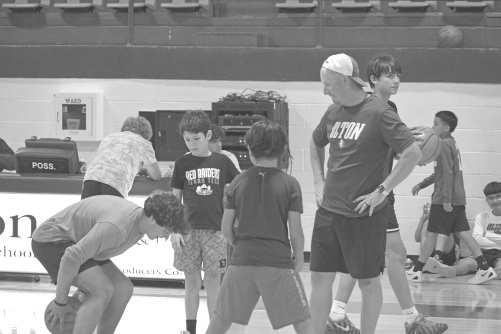 Coach Bobby Workman participates in a postpractice scrimmage with campers at the Olton Mustang basketball camp on Memorial Day. (Photo by Leon Szaniszlo)