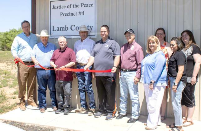 COUNTY OFFICIALS, Clay Carr, County Judge James DeLoach, JP Prct. 4 Matt Hanna, County Commissioner Lee Logan, Sudan Mayor Michael Williamson, JP Prct. 3 Tim Walker, Treasurer Jerry Yarbrough, Deputy Treasurer Terra Hopper, Deputy Treasurer Jaclyn Alford and County Clerk Rene Trevino, host a ribbon-cutting for the grand opening of the new Lamb County Justice of the Peace office for Precinct 4 office located on 405 Highway 84 in Sudan on April 16, 2025. (Photo by Madison Vidales)