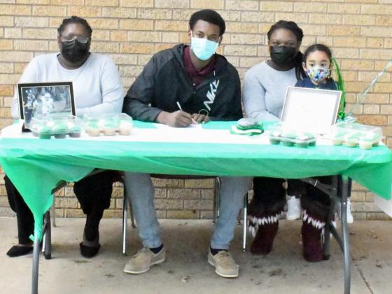 ENMU BOUND —Littlefield senior, Tyree Jones, signed his National Letter of Intent on Wednesday, which was national signing day for high school athletes around the country to play football for Eastern New Mexico University. Jones was surrounded by his family, friends and teammates, as he inked his NLOI in the courtyard of Littlefield High SchooL (Staff Photo by Derek Lopez)
