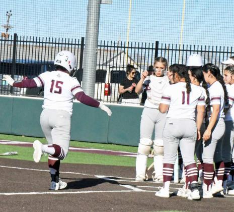 Littlefield’s Natalia Sanchez (15), celebrates a homerun at the plate with her teamates, during the Lady Cats’ district loss to Shallowater on Monday at Lady Cat Field. (Staff Photo by Derek Lopez)