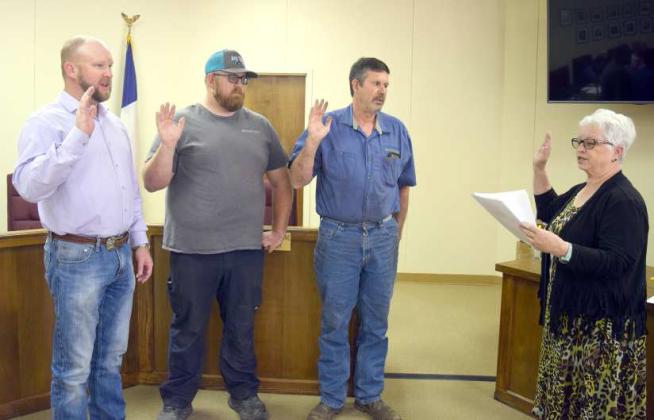 SWEARING IN -- Littlefield Mayor Eric Turpen, Councilman Buddy Holmes, and Councilman Kenny Rucker were sworn into office for another term by City Secretary Janine Butler on Thursday, May 11, 2023. (Photo by Ann Reagan)