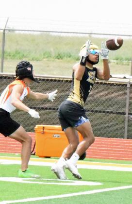 Sudan senior, Jaibryn Ornelas, catches an out route from junior quarterback, Caleb Groetken, during their 7v7 match against Wink in Sudan. (Staff Photo by Derek Lopez)