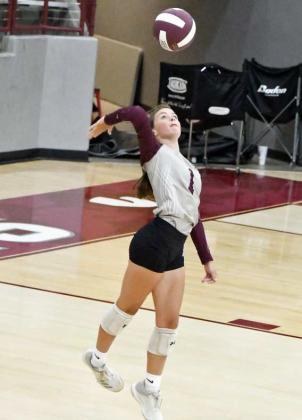 LOOKING FOR AN ACE - Littlefield freshman, Bryndle Ray, leaps up to deliver a jump serve on Tuesday, during their first match against Lubbock Christian High School at Wildcat Gym. (Staff Photo by Derek Lopez)