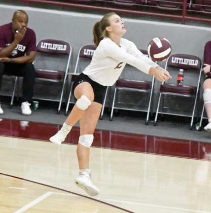 STAYINGALIVE - Littlefield libero, Kennadi Hanlin, backs up to play a ball on the boundary line to keep the ball in play on Tuesday, during their first match against Lubbock Christian High School at Wildcat Gym. (Staff Photo by Derek Lopez)
