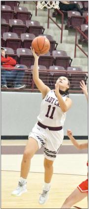 FAST-BREAK POINTS — Littlefield’s Leilani Solis gets out on the fast break and drops in a lay-up, during the first half of the Lady Cats district victory over Denver City on Tuesday in their first meeting of the season with the Fillies. (Staff Photo by Derek Lopez)