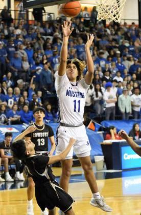 Olton senior, Nate Urbina (11), drops in a lay-up for the Mustangs, during the first half of their, 53-46, Regional Semi-Final loss against Plains on Friday at SPC’s Texan Dome. (Staff Photo by Derek Lopez)