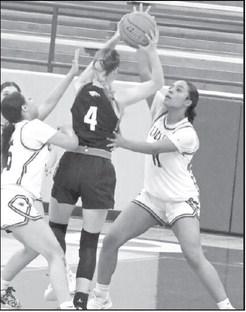 Littlefield’s Nia Cleveland ( 11) and Madison Williams (5) double team Kyndal Grimes, looking for a steal, during the first half of the Lady Cat’s victory over Roosevelt on Wednesday at Wildcat Gym. (Staff Photo by Derek Lopez)
