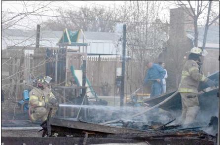 LITTLEFIELD FIREMEN EXTINGUISHING FIRE