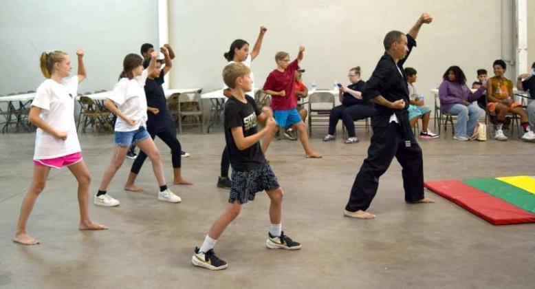 MARTIAL ARTS - Instructor Hutchison McWilliams works with his Little Dragons Class on Tuesday, August. 1st, at Zeke’s, located on Waylon Jennings Ave. (Photo by Ann Reagan)