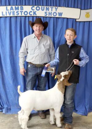 Ryan Muller of Littlefield and his Goat earned Grand Champion at the Lamb County Junior Livestock Show that took place in Littlefield on Saturday. (Photo by Ann Reagan)