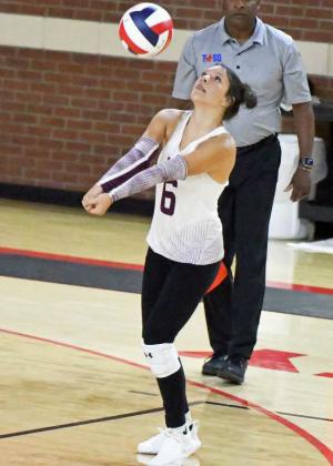 Littlefield’s Madi Brown hits the ball back towards the net, as the Lady Cats look to go on the attack, during the Lady Cats’ second set with the Denver City Fillies on Tuesday night. (Staff Photo by Derek Lopez)