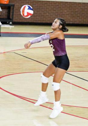 Littlefield’s Monica Elizondo breaks the serve from the Fillies, during the Lady Cats’ first set with Denver City on Tuesday night. (Staff Photo by Derek Lopez)