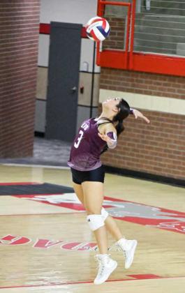 Littlefield’s Bri Valdez delivers a serve during the Lady Cats’ first set with the Denver City Fillies on the road on Tuesday night. (Staff Photo by Derek Lopez)