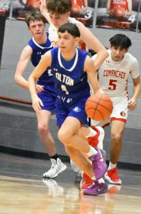 Olton’s Matt Flores picks up a steal and starts the break looking to score in transition, during the first half of the Mustangs Area Championship victory over West Texas on Friday at Tascosa High School. (Staff Photo by Derek Lop